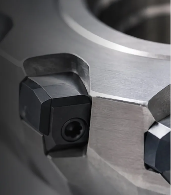 PCD cartridges seated in a face mill cutter body